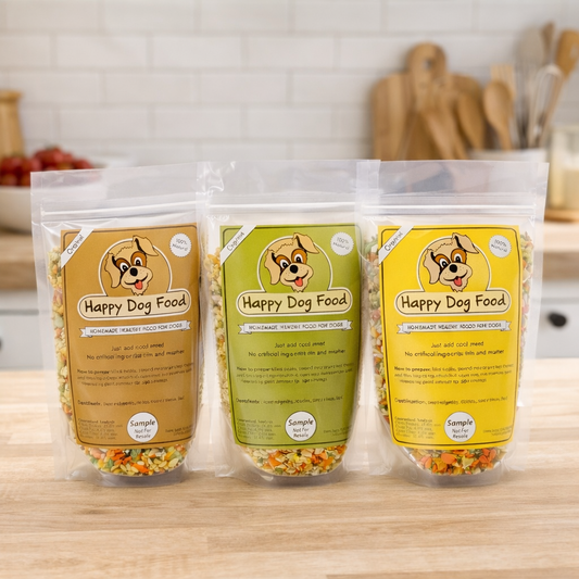 Three packages of Happy Dog Food on a kitchen counter with a blurred background.